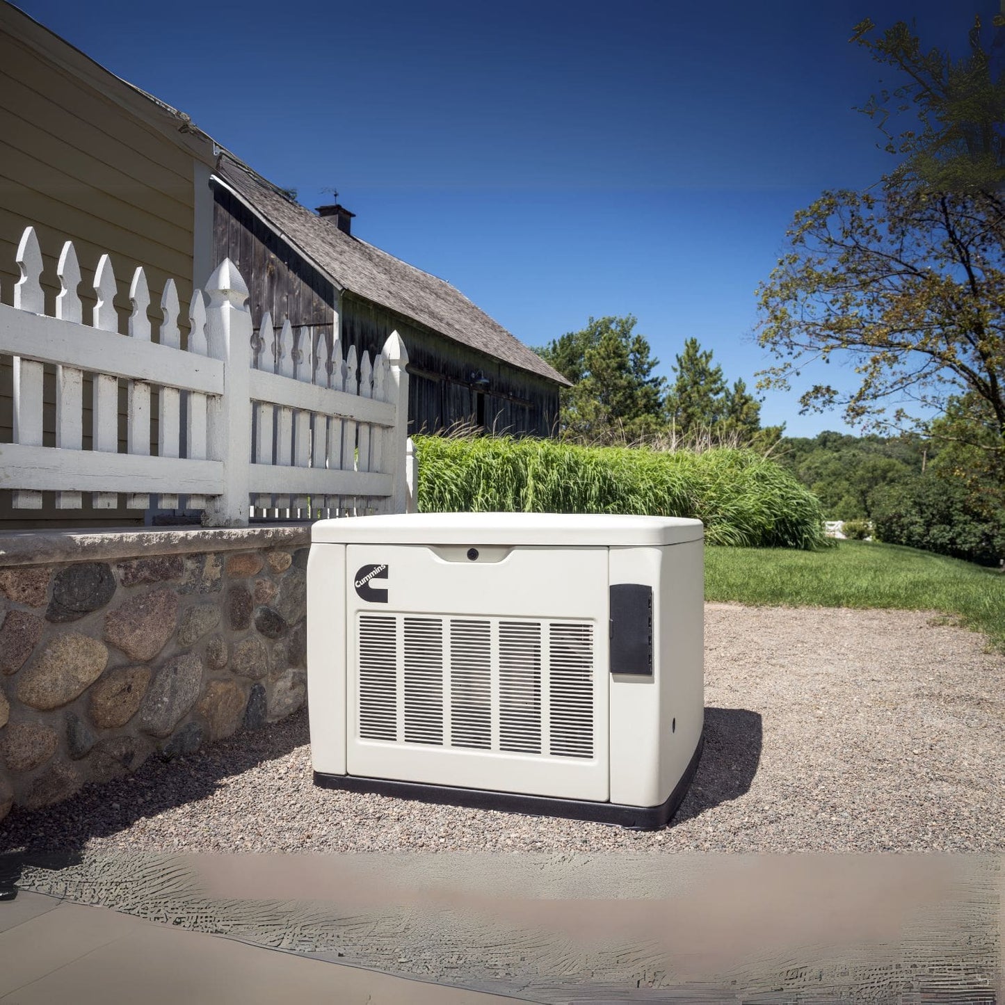 Cummins RS13A 13kW Home Standby Generator installed beside the fence