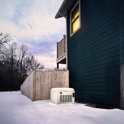 Cummins RS20A 20kW Home Standby Generator installed outside in the snow zoomed-out view