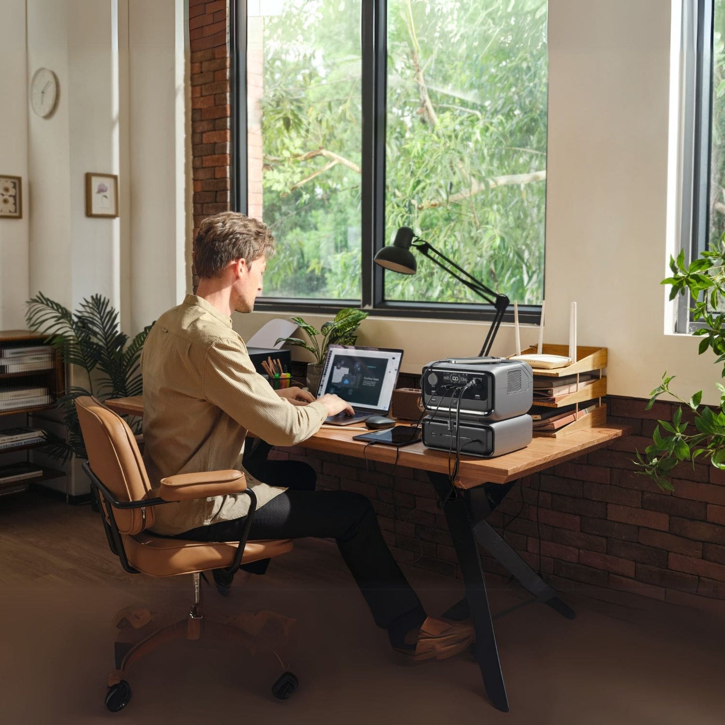 EcoFlow RIVER 3 Max Portable Power Station beside a man with ipad charging