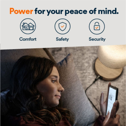 Generac Next-Gen 28kW Home Standby Generator monitored using a phone by a woman